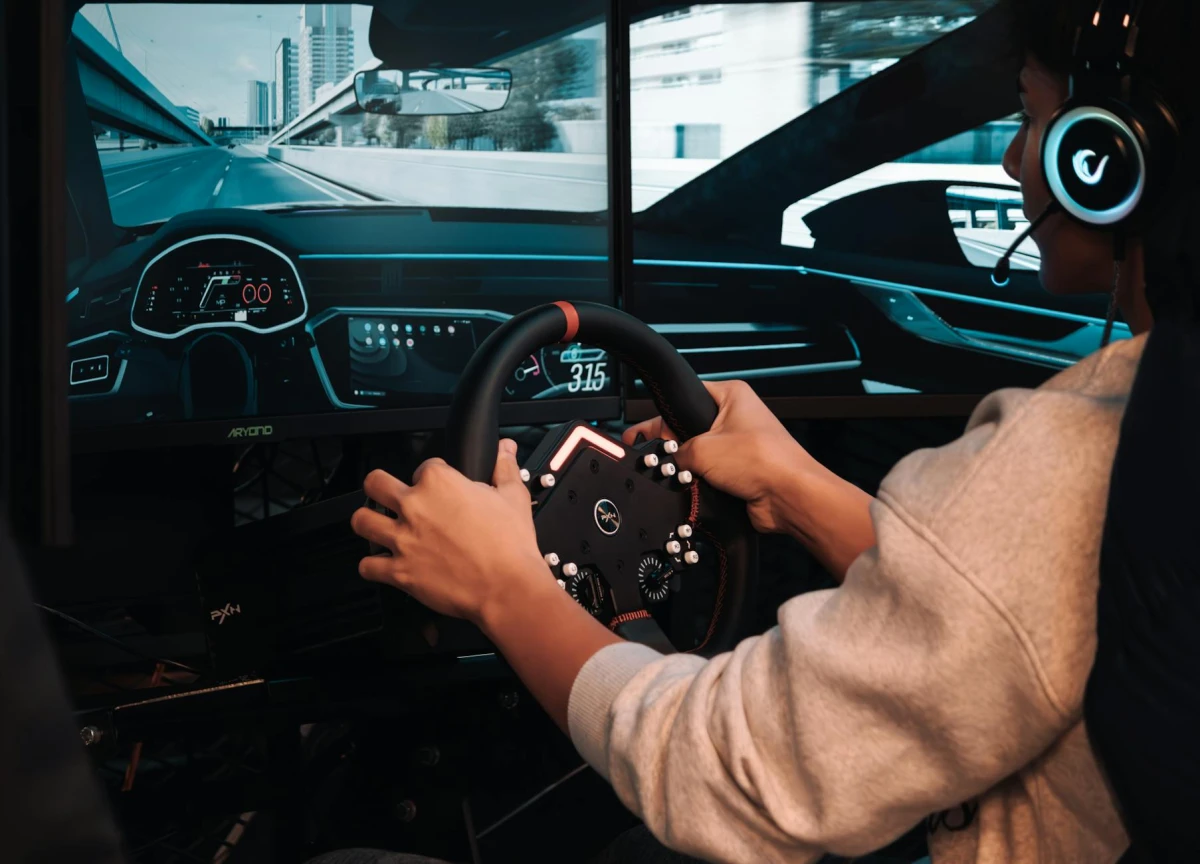 Sim racing rig with wheel and pedals